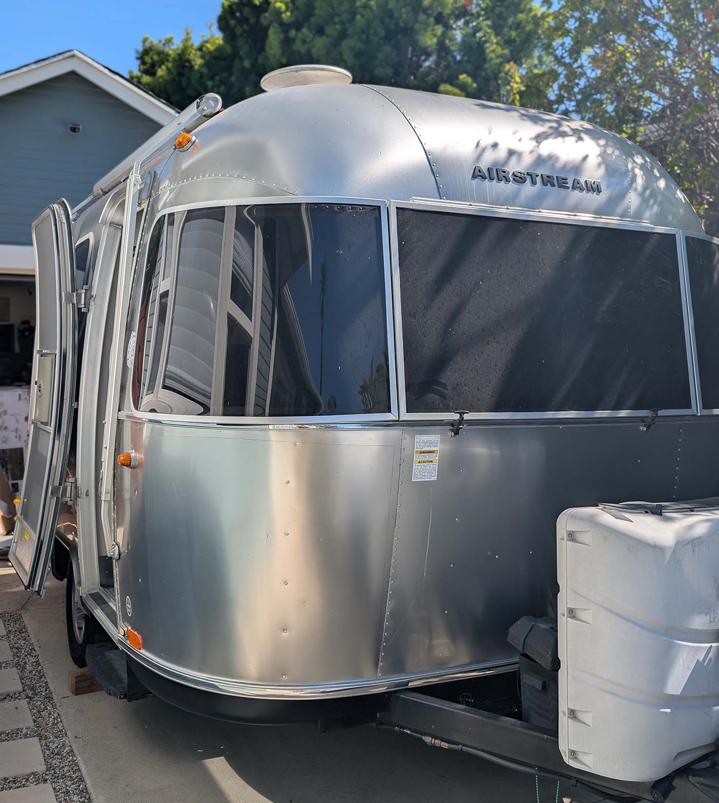 A premium Airstream travel trailer receiving professional maintenance from Vanpire Customs in Los Angeles, California, showcasing our capability to service high-end RVs